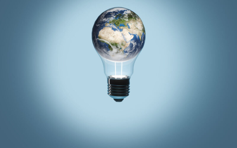 Concept image with globe inside a light bulb