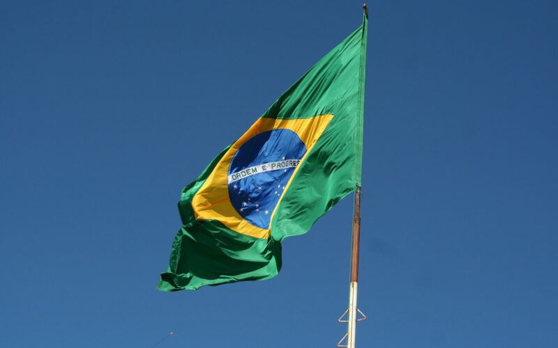 Brasilian flag with blue sky in the background