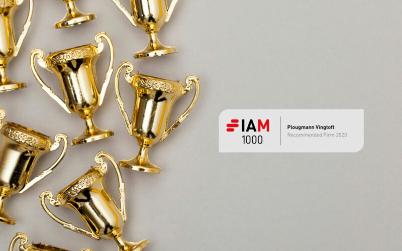 Several awards on grey background with IAM Patent 1000 badge